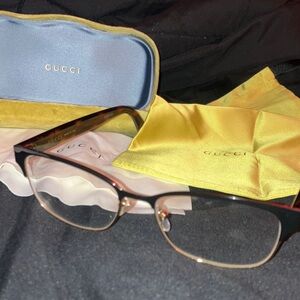 Gucci Black and Gold Frame Glasses